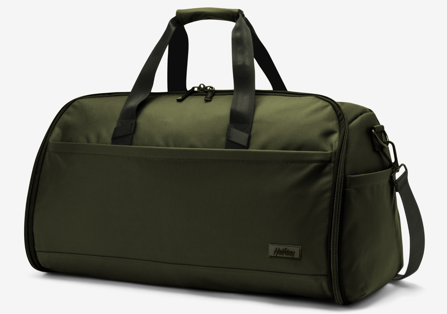 Green duffel bag with black straps on a light gray background