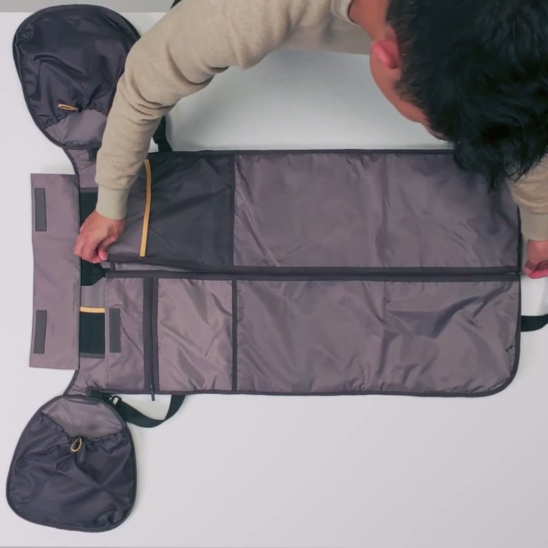 The Garment Duffel laid open, packing a suit flat