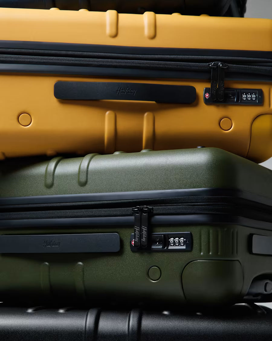 The Carry-On Spinner Plus in Golden, Jet, Marine and Olive